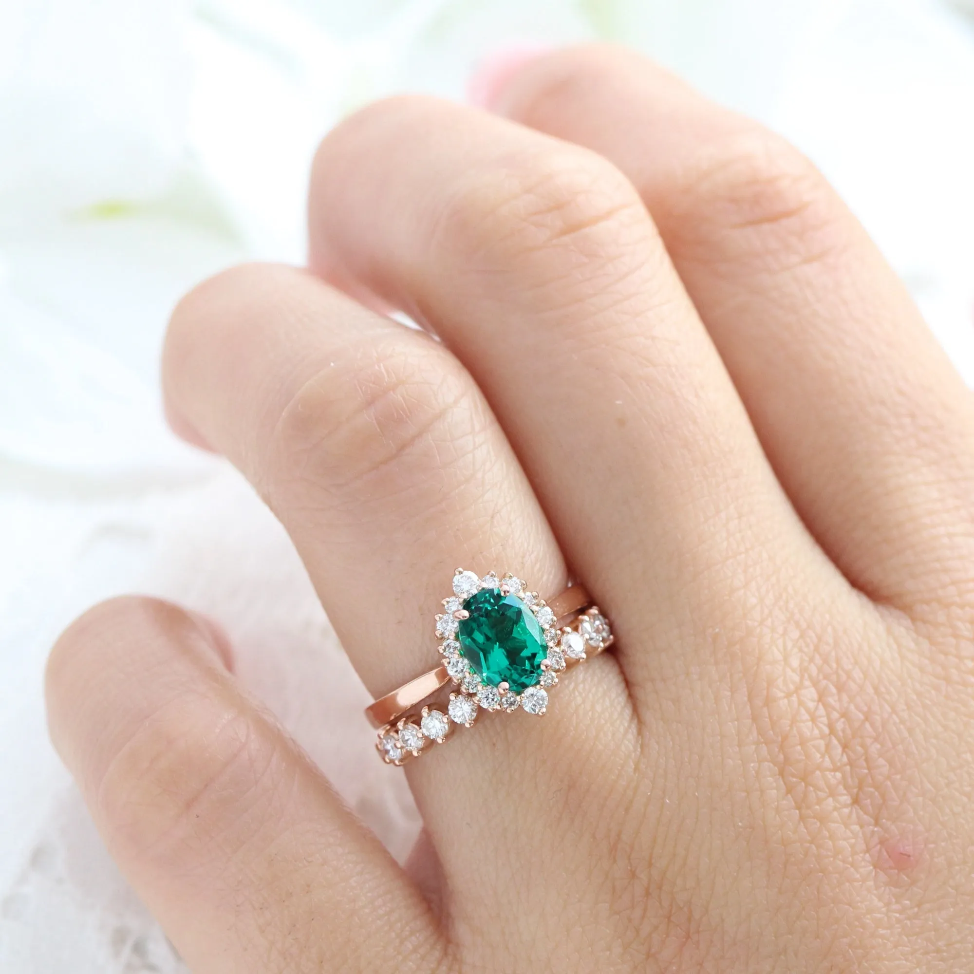 Oval Emerald Engagement Ring in Tiara Halo Diamond Tapered Band