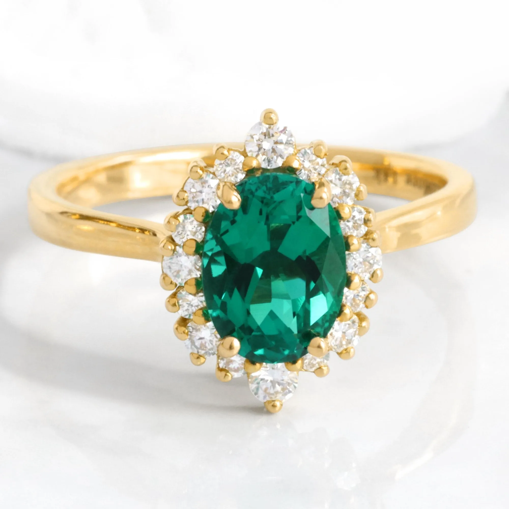 Oval Emerald Engagement Ring in Tiara Halo Diamond Tapered Band